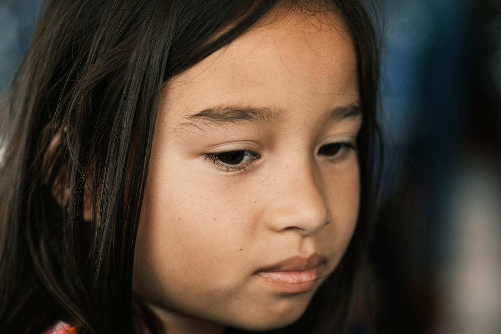 A portrait of a young mixed race filipina girl shot on the fuji xt5 and 56mm 1.2 WR lens.