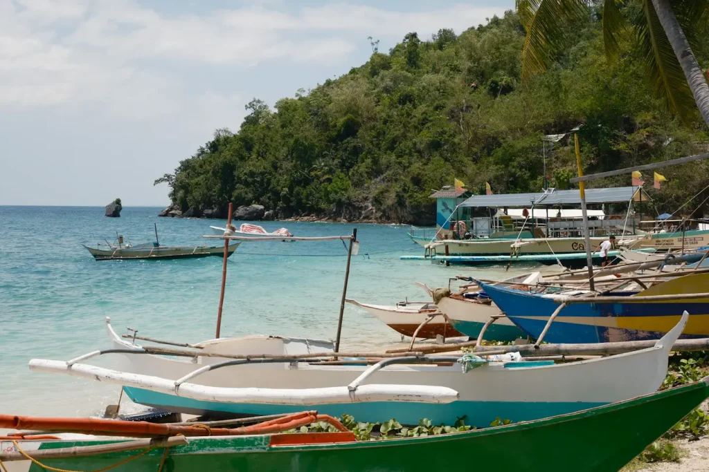 Bangka boats lined up on a beach in the Philippines. Photo taken on the Fujifilm X-T5 camera. 