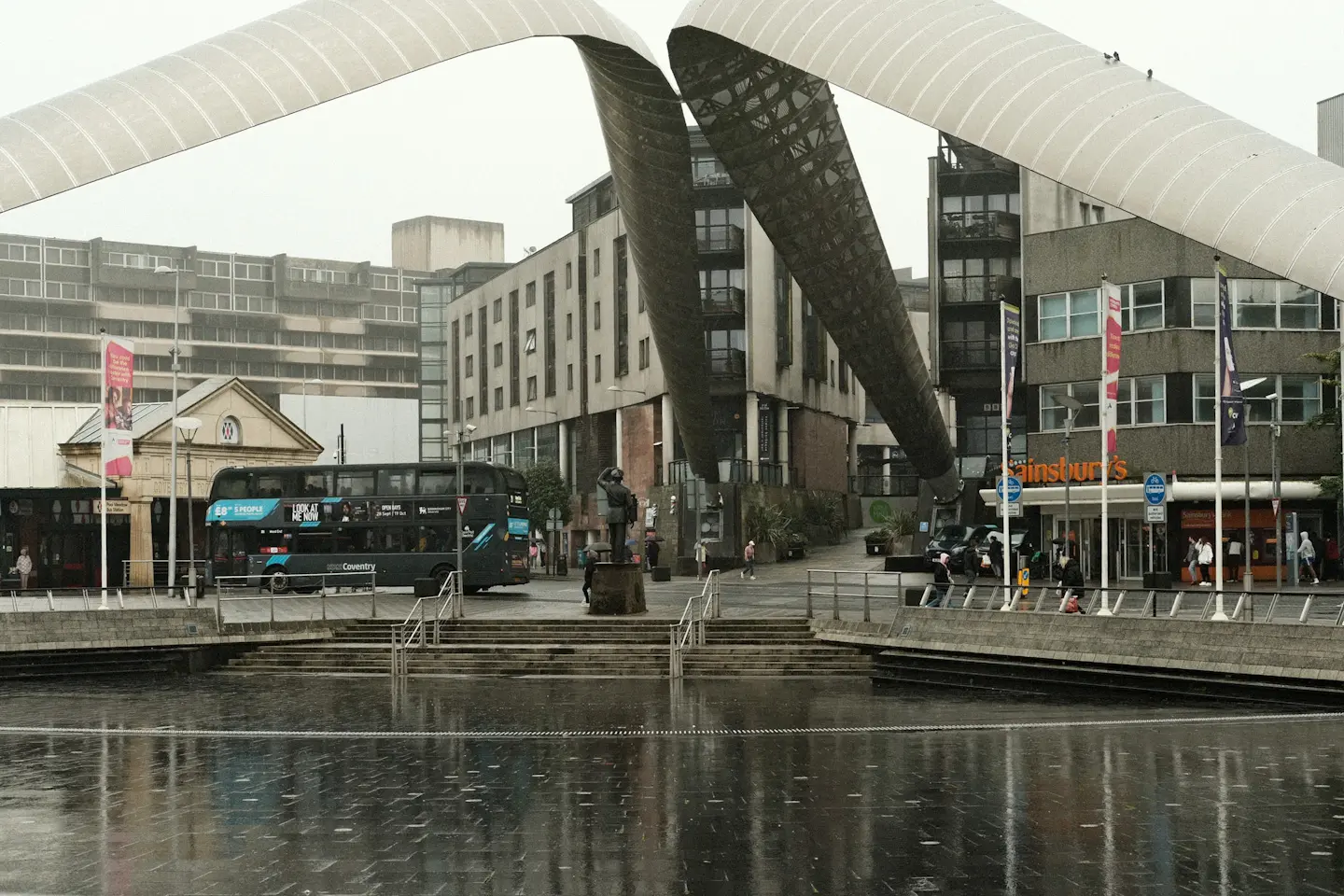 A photo of the area near the bus station in Coventry showing architectural arches.