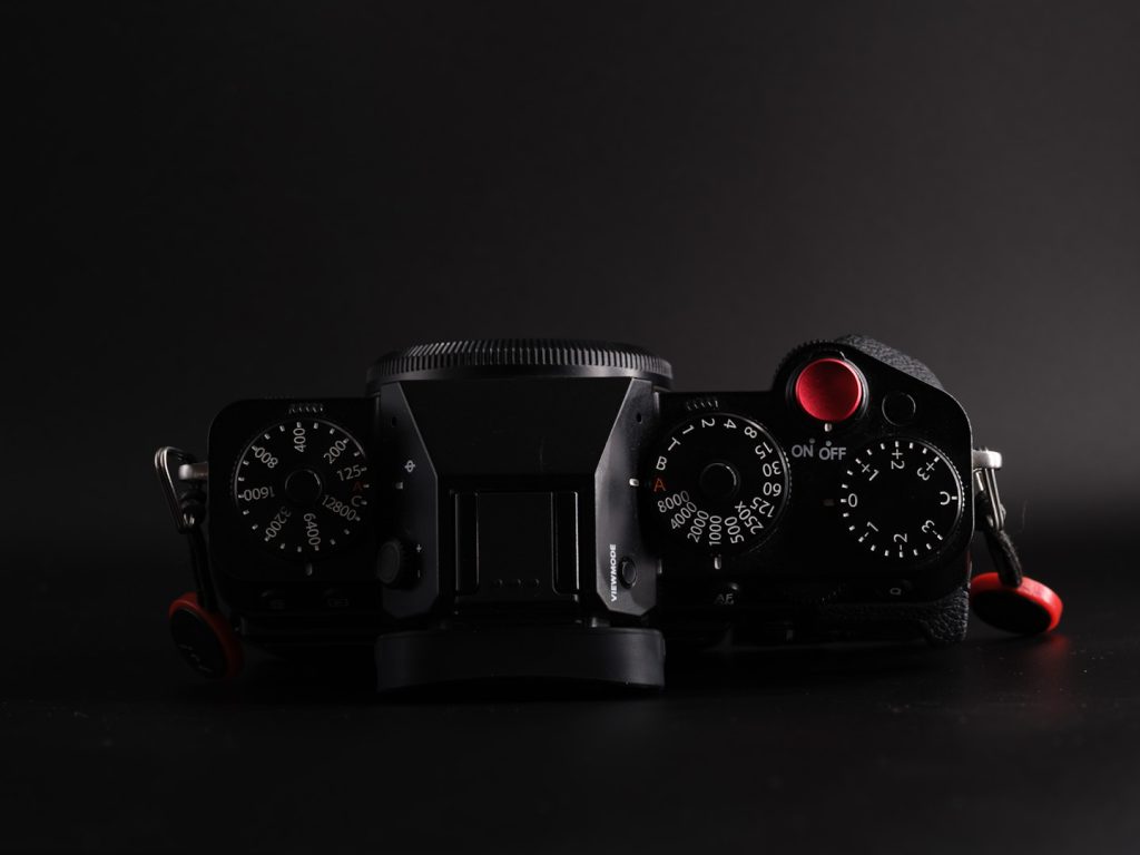 Top view of the Fuji XT5 standard camera grip photographed on a black background in dramatic light.