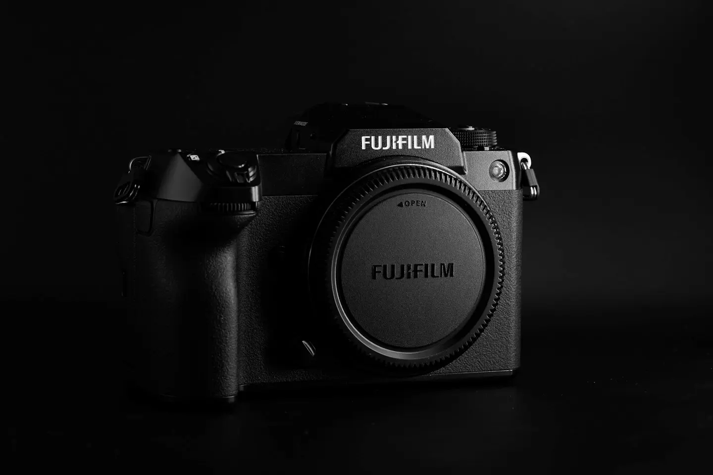 The Fujifilm GFX100S camera on a black background in dramatic light. Photographed in my studio in the Philippines