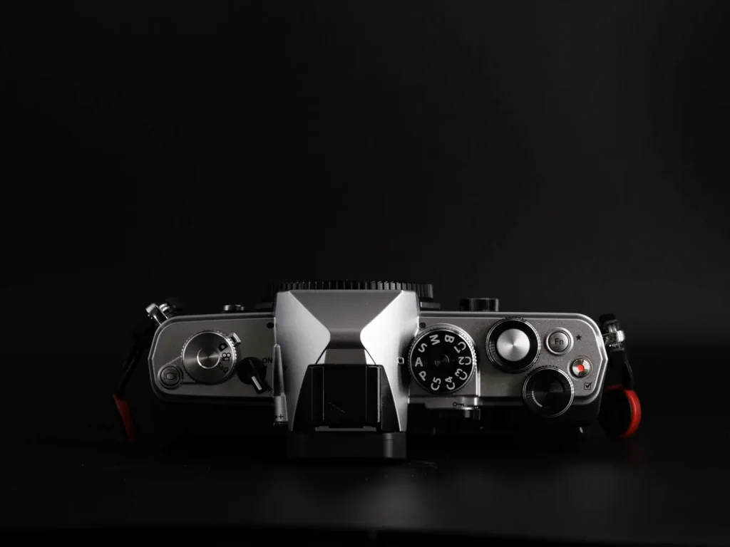 Om System OM-3 camera photographed to show the top view including dials with no grip attached.