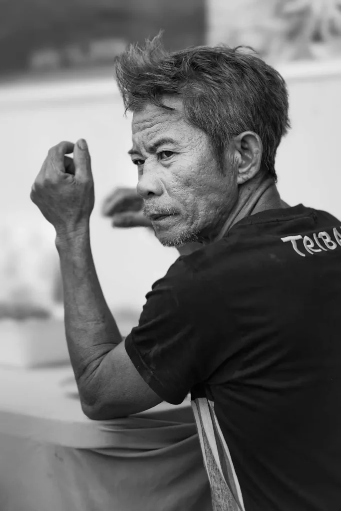 A photo of a middle aged Filipino man shot in black and white on the Fujifilm XF 56mm 1.2WR lens.
