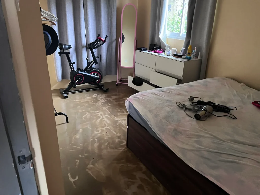 A bedroom after it has been flooded.