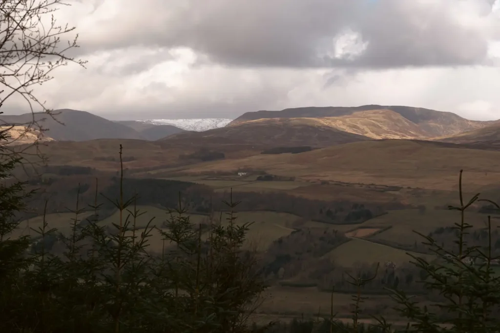 A view of Glen Turret and Ben Chonzie in the distance covered in snow. The photo is taken from the Knock of Crieff. 