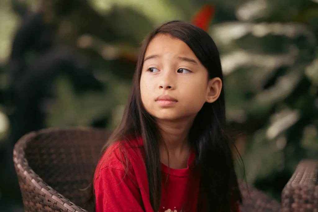 A portrait of a girl sat in a tropical garden in the Philippines. Photo is taken on the Nikon Z8 camera with the Nikon Z 85mm 1.8S lens. 