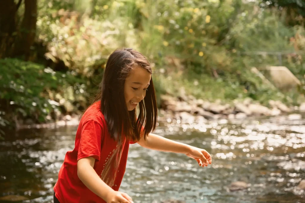 My daughter Sofia, who is 10 years old, playing on rocks in the river Earn in Crieff, Scotland.