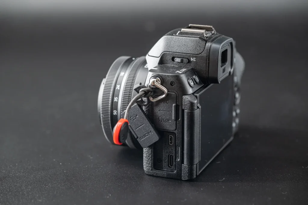 The left side of the Nikon Z50II with the USB-C charging port visible.