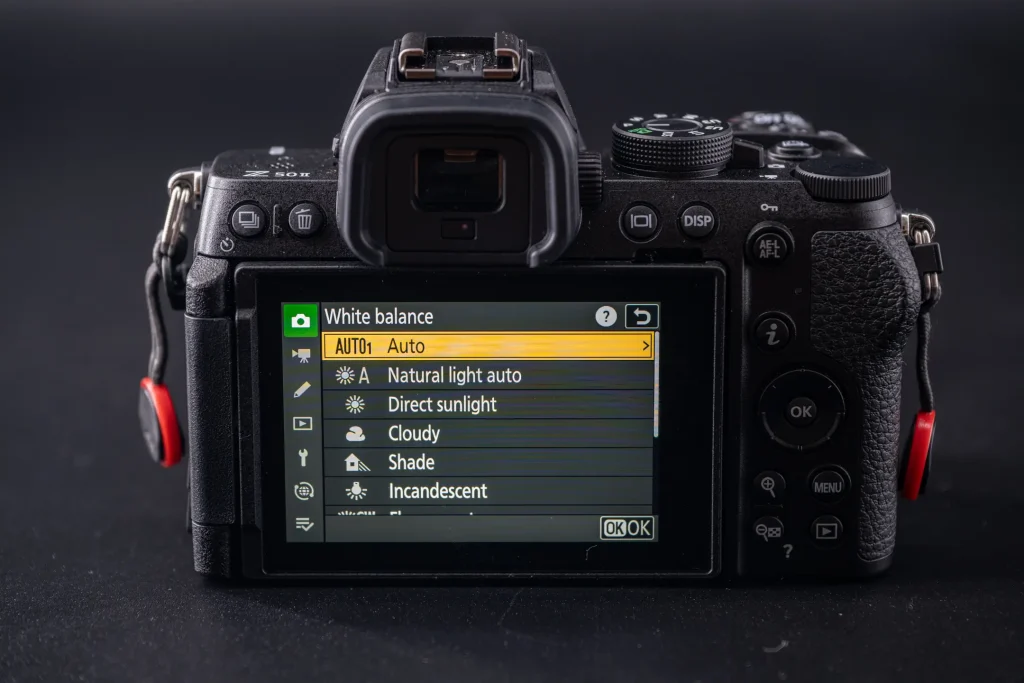 The rear of the Nikon Z50II with the LCD screen showing Auto1 auto white balance option selected.