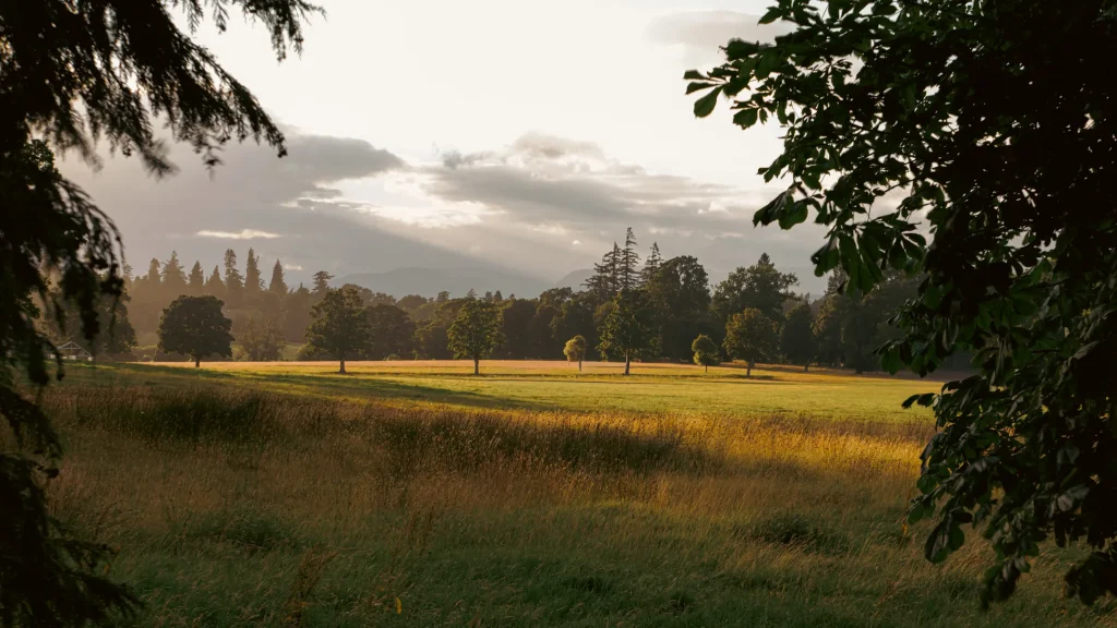 A photo showing the beautiful colors of warm eveing light over Strathearn Castel estate in Auchterarder Scotland. 