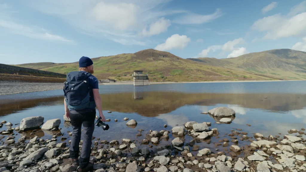 A photo of me at Loch Turret carrying my hiking backpack and the Nikon Z8 camera.