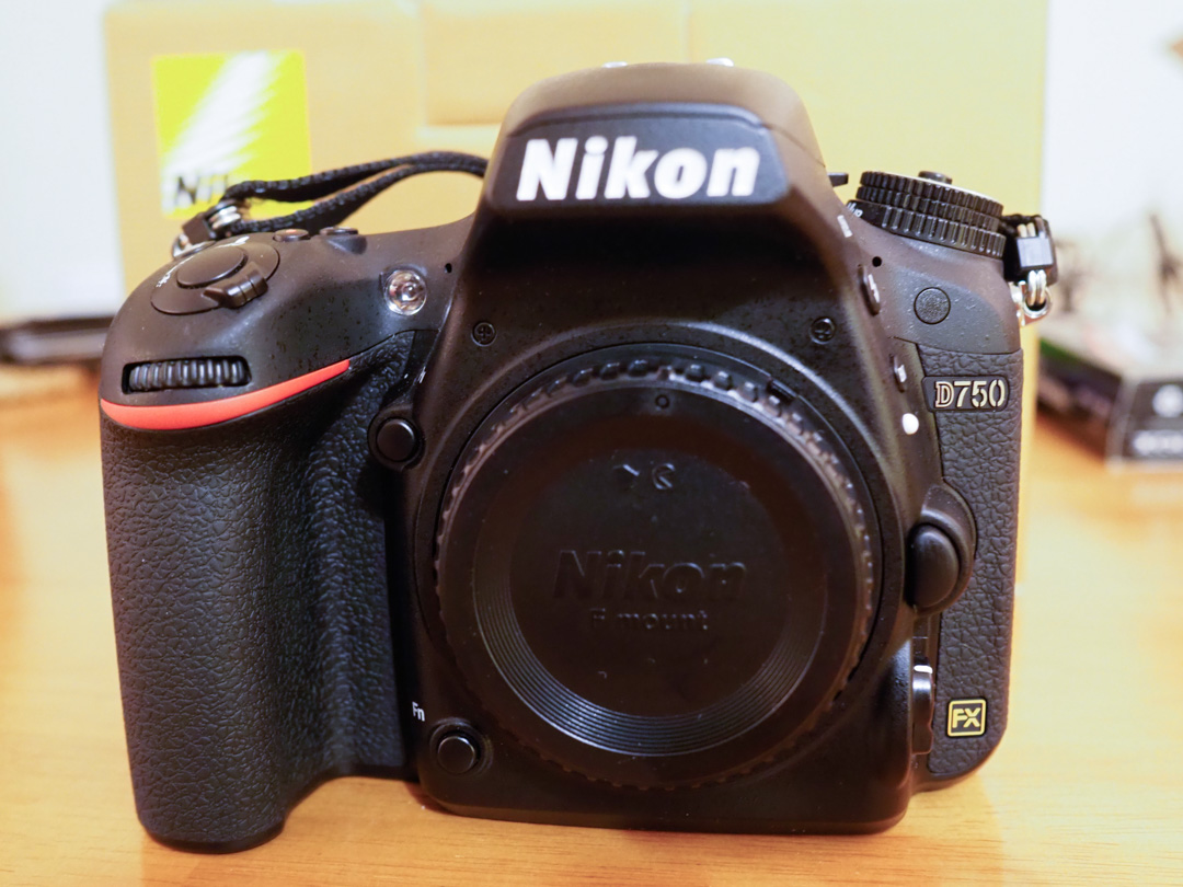 The Nikon D750 camera sat on a computer desk.