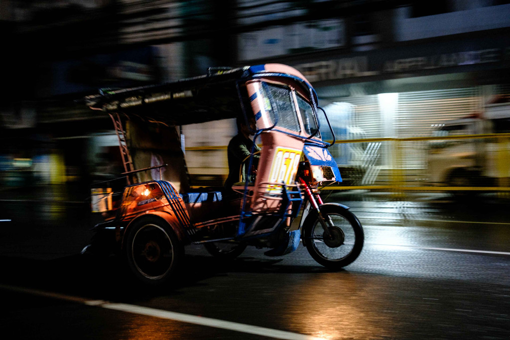 A trike in the Philippines at night shot on the Fuji X-T5